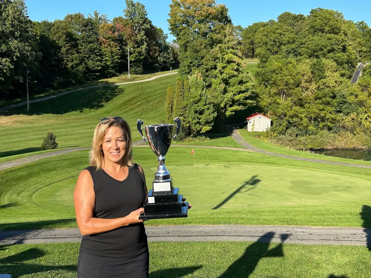 a woman standing in a park