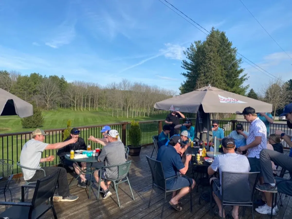 a group of people sitting at a park